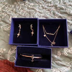 Never worn earrings, bracelet, and necklace set.